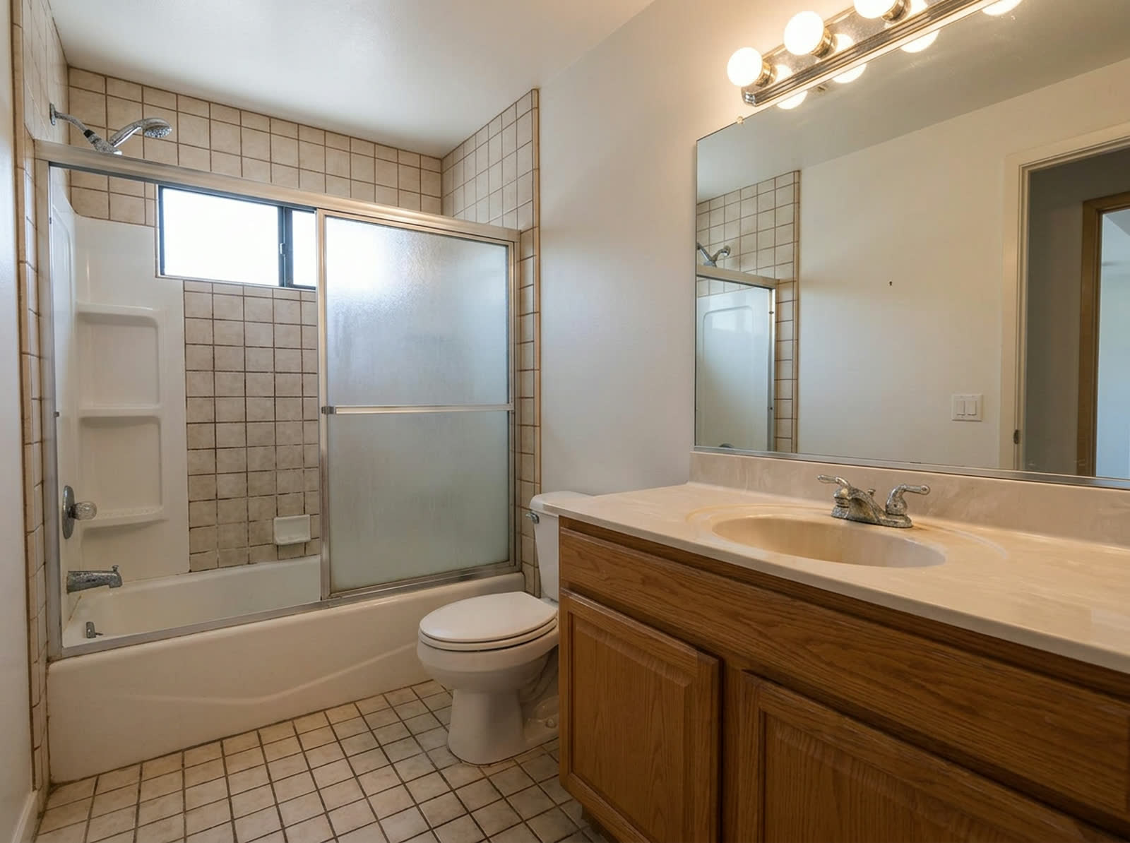 Dated bathroom before renovation, photographed from the reference camera position